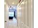 Hallway with view into bedroom and double doors to closet at 26607 Chimney Spire Ln, Wesley Chapel, FL 33544