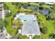 Aerial view of community pool, patio, and cabana at 26607 Chimney Spire Ln, Wesley Chapel, FL 33544
