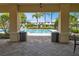View of the community pool from the covered patio at 26607 Chimney Spire Ln, Wesley Chapel, FL 33544