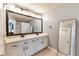 Double vanity bathroom with large mirror and ample storage at 26607 Chimney Spire Ln, Wesley Chapel, FL 33544