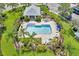 Community pool with surrounding patio and lounge chairs at 26607 Chimney Spire Ln, Wesley Chapel, FL 33544