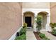 Private entrance with landscaping and walkway at 26607 Chimney Spire Ln, Wesley Chapel, FL 33544