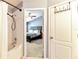 Bathroom with tub, shower, and view into bedroom at 26607 Chimney Spire Ln, Wesley Chapel, FL 33544