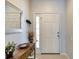 Bright entryway with mirror, console table and decor at 26607 Chimney Spire Ln, Wesley Chapel, FL 33544