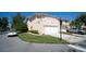 Two-story townhome with attached garage and driveway at 121 Valencia Cir, St Petersburg, FL 33716