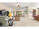 Open living area with comfortable seating and views to kitchen and backyard at 9343 Rolling Circle, San Antonio, FL 33576