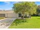 Single-story home with a two-car garage at 9343 Rolling Circle, San Antonio, FL 33576