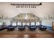 Elegant banquet hall with a stage and dance floor at 9343 Rolling Circle, San Antonio, FL 33576