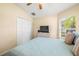 Bright bedroom with double doors and window at 9343 Rolling Circle, San Antonio, FL 33576