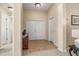 Bright and spacious entryway with tile flooring and access to other rooms at 9343 Rolling Circle, San Antonio, FL 33576