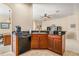Kitchen island with granite countertop and sink at 9343 Rolling Circle, San Antonio, FL 33576