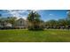 Community clubhouse with golf cart parking at 9343 Rolling Circle, San Antonio, FL 33576