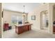 Home office with large desk, built-in shelving, and plenty of natural light at 9343 Rolling Circle, San Antonio, FL 33576