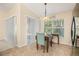 Bright breakfast nook with table and chairs near a window at 9343 Rolling Circle, San Antonio, FL 33576