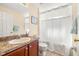 Bathroom with a bathtub, shower, and single vanity at 9343 Rolling Circle, San Antonio, FL 33576