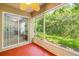 Screened patio with access to backyard at 9343 Rolling Circle, San Antonio, FL 33576