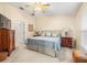 Spacious bedroom with a king-size bed and wood dresser at 9343 Rolling Circle, San Antonio, FL 33576