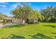 Single-story house with a two-car garage and well-maintained lawn at 9343 Rolling Circle, San Antonio, FL 33576