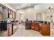 Open kitchen with granite counters and a breakfast bar at 9343 Rolling Circle, San Antonio, FL 33576