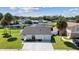 Single story home with driveway and landscaped yard at 10316 Fernbrook Ln, Tampa, FL 33624