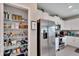 Well-organized pantry with ample shelving for food storage at 12958 Wildflower Meadow Dr, Riverview, FL 33579