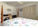 Bedroom with a four-poster bed, closet, and an additional storage unit at 1745 Harbor W Cir, Largo, FL 33770