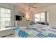Bedroom featuring a dresser with a TV and a view of the screened patio at 1745 Harbor W Cir, Largo, FL 33770