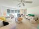 Bright living room with neutral tones and comfortable seating; ideal for gatherings and relaxation at 1745 Harbor W Cir, Largo, FL 33770