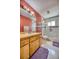 Bathroom with wood vanity and a walk-in shower at 2011 Green Juniper Ln, Brandon, FL 33511