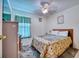 Cozy bedroom with a queen-size bed and ceiling fan at 2011 Green Juniper Ln, Brandon, FL 33511