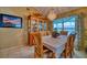 Elegant dining room with chandelier, hutch and table setting at 2011 Green Juniper Ln, Brandon, FL 33511