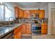Updated kitchen with granite countertops and stainless steel appliances at 2011 Green Juniper Ln, Brandon, FL 33511
