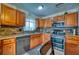 Modern kitchen featuring wood cabinets and granite countertops at 2011 Green Juniper Ln, Brandon, FL 33511