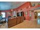 Spacious living room with vaulted ceiling, fireplace, and leather furniture at 2011 Green Juniper Ln, Brandon, FL 33511
