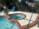 Backyard pool features an attached in-ground hot tub, perfect for relaxing at home at 2011 Green Juniper Ln, Brandon, FL 33511