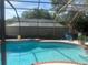 Well maintained backyard pool with brick trim inside a screen enclosure at 2011 Green Juniper Ln, Brandon, FL 33511