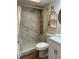 Modern bathroom with marble shower and stylish shelving at 2363 Newburg Ln # B, Safety Harbor, FL 34695