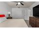 Bright bedroom featuring a ceiling fan, window, a dresser, and closet space at 5313 Bayshore Blvd # 5313, Tampa, FL 33611
