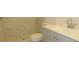 Updated bathroom with gray vanity and marble-look shower tile at 6026 22Nd N Ave # 5, St Petersburg, FL 33710