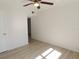 Bedroom with light gray wood-look flooring and ceiling fan at 6026 22Nd N Ave # 5, St Petersburg, FL 33710