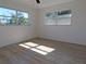 Sunlit bedroom featuring wood-look floors and a ceiling fan at 6026 22Nd N Ave # 5, St Petersburg, FL 33710