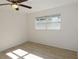 Well-lit bedroom featuring a ceiling fan and light wood floors at 6026 22Nd N Ave # 5, St Petersburg, FL 33710