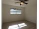 Spacious bedroom with large window and ceiling fan at 6026 22Nd N Ave # 5, St Petersburg, FL 33710