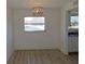 Bright dining room with large window and hardwood floors at 6026 22Nd N Ave # 5, St Petersburg, FL 33710