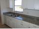 Kitchen with granite countertops and white cabinets at 6026 22Nd N Ave # 5, St Petersburg, FL 33710