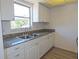 Kitchen with granite countertops and white cabinets at 6026 22Nd N Ave # 5, St Petersburg, FL 33710