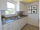 Kitchen with granite countertops and white cabinets at 6026 22Nd N Ave # 5, St Petersburg, FL 33710