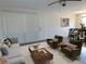 Open living room with a sofa, armchairs, and view into dining area at 6026 22Nd N Ave # 5, St Petersburg, FL 33710