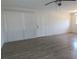 Spacious living room with wood-look floors and lots of natural light at 6026 22Nd N Ave # 5, St Petersburg, FL 33710