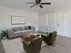 Bright living room features a comfy sofa, wood coffee table, and two armchairs at 6026 22Nd N Ave # 5, St Petersburg, FL 33710